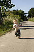 Baby girl running on single track