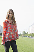 Young woman standing in park, portrait