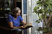 Senior woman reading book