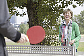 Couple playing table tennis