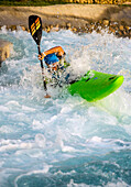 Paddler turning through waves, Al-Ain, Dubai, UAE