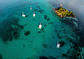 Sea kayak tour with catamarans as basecamp on Seychelles, Indian Ocean