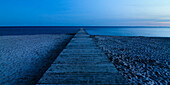Wooden boardwalk at dusk, Fehmarn, Baltic sea, Schleswig-Holstein, Germany