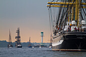 Russian clipper ship, Kruzenshtern and Friedrichsort lighthouse at the windjammerparade, Kieler Woche, Kiel fjord, Baltic sea, Schleswig-Holstein, Germany