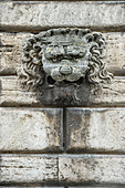 Lions head on a wall of a palace, Montepulciano, province of Siena, Tuscany, Italy