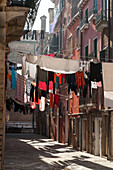 typical, washing line strung outside across narrow, alley, callo, Castello, Venice, Italy