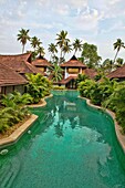 luxury resort pool villas in the backwaters of Kerala, India.