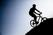 Silhouette biking btt decline in the Sierra de Cazorla, Andalucia, Spain