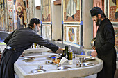 Greece, Chalkidiki, Mount Athos peninsula, listed as World Heritage, Vatopedi monastery, Monks setting the marble tables of the Dining Hall.