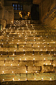 India, Uttar Pradesh, Varanasi, Dev Deepawali festival, Earthen lamps lit on the stairs leading to the Ganges.