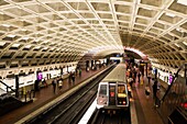 Commuter waits for metro, Washington DC, USA.