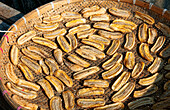 South East Asia, Laos, Luang Prabang, Locals Make Sun Dried Bananas To Sell In Marketplace.