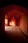 Corridor of red sandstone in buildings beside the Taj Mahal, Agra, India.