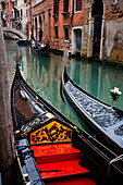 'Gondolas in a canal; Venice, Italy'