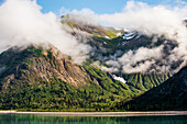 Scenic view of mountains and coastline as fog lifts, Tongass National Forest, Southeast Alaska