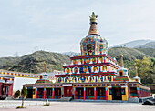 'Huge colourful Buddhist temple (stupa) at Wutun Si monastery; Tibet, China'