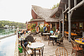 Guests dining at The Saltry Restaurant in Halibut Cove, Kachemak Bay, Southcentral Alaska.