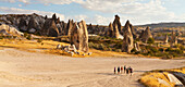 'A tour group walks down a road in Rose Valley; Cappadocia, Turkey'