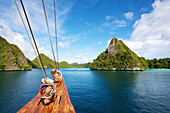 'Tiger Blue Phinisi Schooner sailing through Pulau Wayag Islands of Raja Ampat; Indonesia'