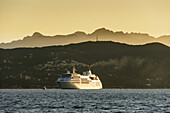 'Cruise ship at sunrise; Porto Venere, Liguria, Italy'