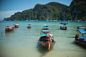 'Boats sit in the bay of Koh Phi Phi Island in the Andaman Sea; Thailand'