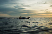 'A boat sails across the Andaman Sea towards the island of Koh Phi Phi in southern Thailand; Thailand'