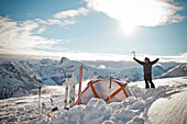 A backcountry skier poses for a picture at basecamp in Coquihalla Recreation Area in British Columbia, Canada.