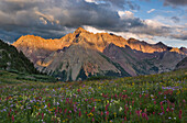 Sunset on Pyramid peak, one of Colorado's popular fourteeners, and a field of wildflowers on Buckskin pass near Aspen.