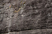 Man climbing on the granite of Premia Balmafredda's crag. Premia, Ossola, Italy.