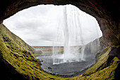 'Seljalandsfoss waterfall, photographed from behind the water; Iceland'