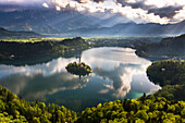 Lake Bled reflections at sunrise, Julian Alps, Gorenjska, Slovenia, Europe