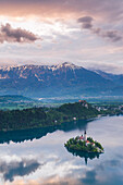 Lake Bled Island and the Julian Alps at sunrise, seen from Osojnica Hill, Bled, Julian Alps, Gorenjska, Slovenia, Europe