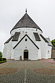 Exterior view of the 13th century circular design Osterlars Church, Bornholm, Denmark, Scandinavia, Europe