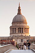 Millennium Bridge and St. Paul's Cathedral at sunrise, London, England, United Kingdom, Europe