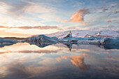 Winter sunset over Jokulsarlon, a glacial lagoon at the head of the Breidamerkurjokull Glacier on the edge of the Vatnajokull National Park, South Iceland, Iceland, Polar Regions