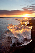 Icebergs at sunset on Jokulsa Beach, on the edge of the Vatnajokull National Park, South Iceland, Iceland, Polar Regions