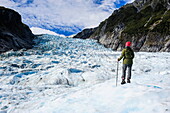 Woman standing on the ice of Fox Glacier, Westland Tai Poutini National Park, South Island, New Zealand, Pacific