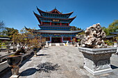 Wanjuan Pavilion at Mufu Wood Mansion with lined up potted bonsai and rocks, Lijiang, Yunnan, China, Asia