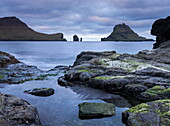 Looking out towards the island of Tindholmur from the coast of Vagar in the Faroe Islands, Europe