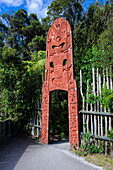 Wooden carved entrance at the Te Puia Maori Cultural Center, Rotorura, North Island, New Zealand, Pacific
