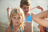 Girl looking at camera, lake Starnberg, Upper Bavaria, Bavaria, Germany