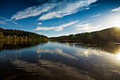 Sunset, Reflection of the sky in the Windgfaellweiher, near lake Titisee, Black Forest, Baden-Wuerttemberg, Germany