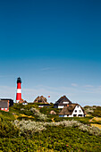 Thatched houses and lighthouse, Hoernum, Sylt Island, North Frisian Islands, Schleswig-Holstein, Germany