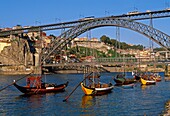 Boats of the Porto winneries over Duero River D  Luis I Bridge. Porto. Portugal.