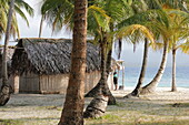 traditional hut of the Kuna Indians on the sandy beach of San Blas Islands, Panama, Central America.