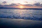 Sunset on the Pacific Ocean seashore of California, USA
