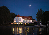 Hotel Restaurant Inselwirt at full moon, Fraueninsel, lake Chiemsee, Bavaria, Germany