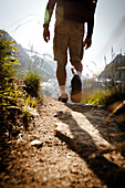 Hiker on mountain trail, on the way to Schreckhorn hut, Lower Grindelwald glacier, Bernese Oberland, Switzerland