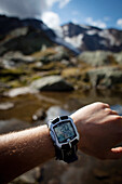 Having a look at the altimeter, ascent to Bremer Hut (2413 m), rear of Gschnitz Valley, Stubai Alps, Tyrol, Austria