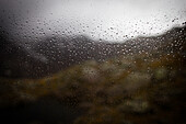 Raindrops on a window, inside a hut, rear of Gschnitz Valley, Stubai Alps, Tyrol, Austria